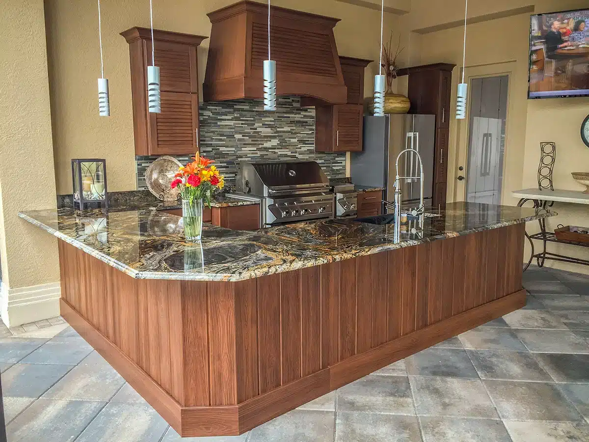 Outdoor Kitchen with Crown Molding Shiplap Wall Cabinets Hood